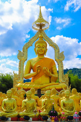 golden Buddha statue with among small 1,250 Buddha statue at Makha Bucha Buddhist memorial park located at nakhon nayok province, Thailand