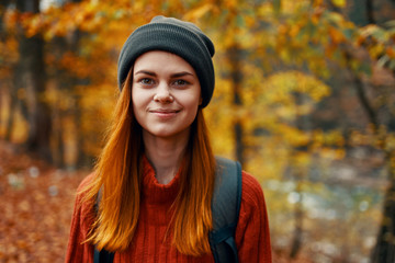 Fototapeta na wymiar portrait of young woman in autumn park