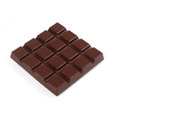 Dark chocolate bar isolated on a white background.