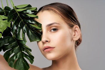 portrait of young woman with flower