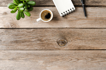 Office desktop with accessories on wooden background. Top view