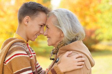 Fototapeta premium Portrait of happy grandmother and grandson posing