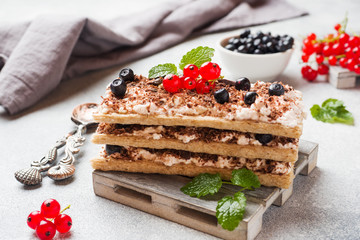 Cottage cheese dessert of crispy dietary bread, curd and blueberries with red currants. Selective focus.