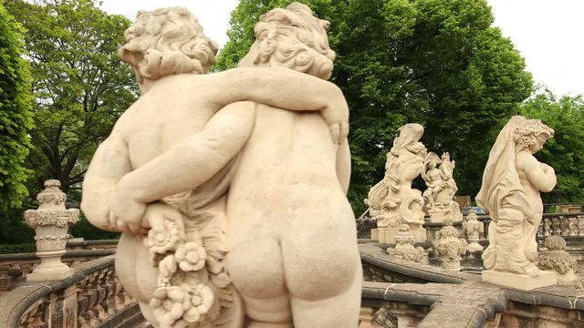 Closeup stone statue of child faunus at Zwinger palace in Dresden, Germany. Close up, prores, slow motion