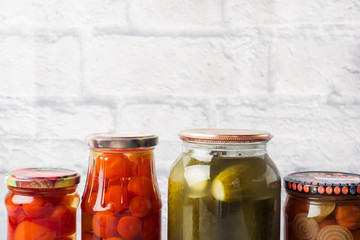 Preservation of vegetables in banks. Fermentation products. Harvesting cucumbers and tomatoes for the winter. Copy space