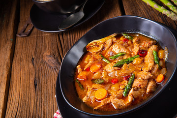 colorful turkey fricassee with asparagus and paprika