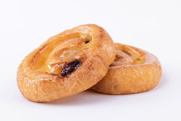 Two tasty puff pastry rolls with honey on top