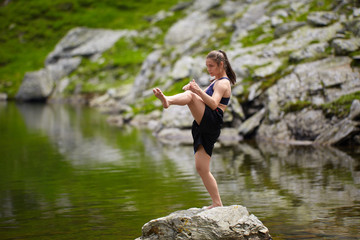 Woman kickbox fighter training by the lake