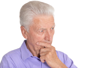 Thinking senior man isolated on white background