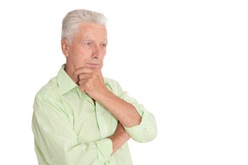 portrait of thinking senior man on white background