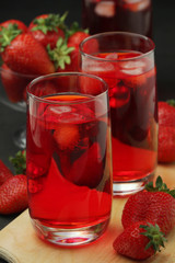 Glasses with strawberry drink with ice