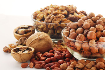 Different nuts in glass cups