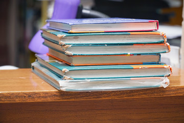 Old books in a stack on a wooden table