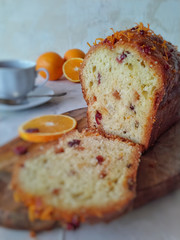 cake with fruits and nuts. Cut a rectangular orange cupcake closeup.