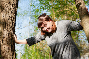 Portrait of beautiful cute girl in summer or spring park