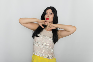 Portrait of a beautiful young brunette isolated on white background. Woman posing in the studio