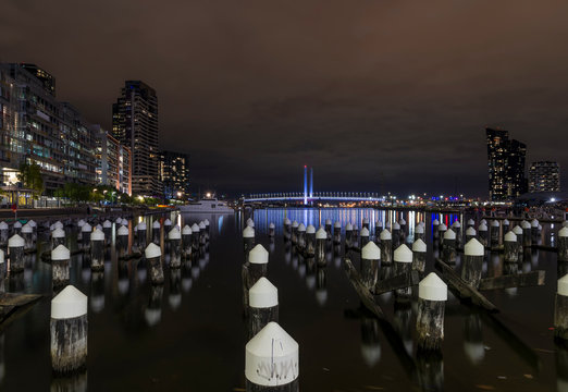 Beautiful night view of Melbourne docklands and Bolte Bridge, with reflections on the Yarra River, Melbourne, Australia