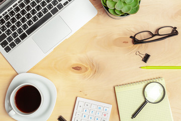 Laptop computer keyboard with magnifying glass, concept of search