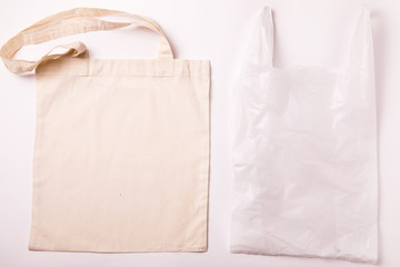 Canvas cotton shopping eco friendly bag over white background. Zero waste, plastic free concept. Top view, flat lay