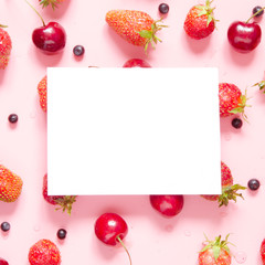 Creative layout of berries with space for text on white paper. Mockup. View from above. - Image