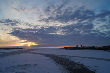 Winter view of Arkhangelsk city from a bridge over Northern Dvina, Russia