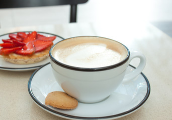 Cappuccino and strawberry tart.