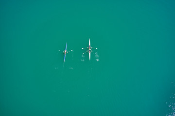 Aerial photography with drone. Boats canoe in motion on the water.
