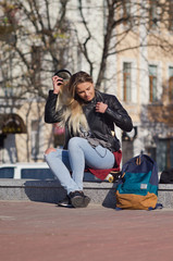 Lady girl happy smiles, sits skateboard.