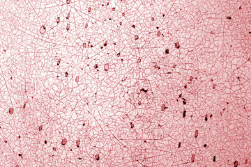 Cracks on metal texture in red tone.