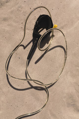 Surfboard leash on beach