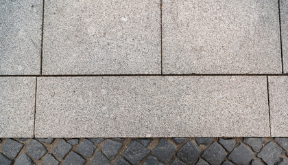 Background from two different paving stones new and old