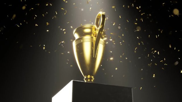 Golden metallic trophy cup on the platform. Award for a winner. Falling confetti