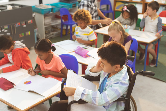 School kids studying in the classroom at school