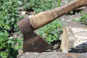 photo ax stuck in a log 