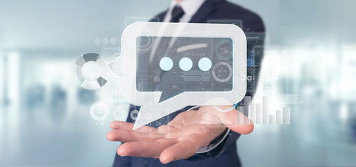 View of a Businessman holding a message icon with data in background - 3d rendering