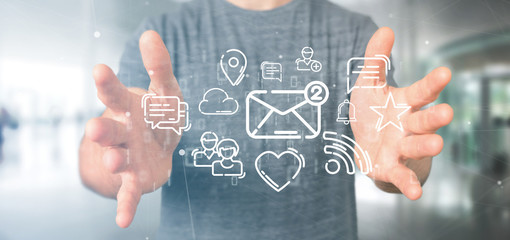 Businessman holding a cloud of social media network icon