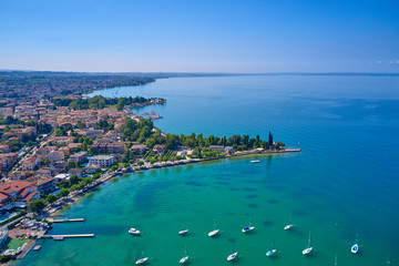 Aerial photography with drone. Beautiful coastline. In the city of Bardolino, Lake Garda, Italy.
