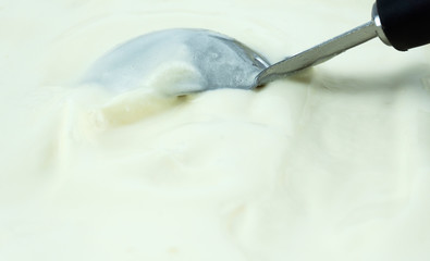 Fototapeta na wymiar Scooping vanilla ice cream close up, Front view, Blank for design..