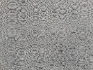 Pavimento in cemento lisciato ondulato grigio
