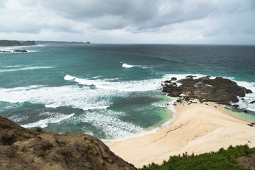 Dramatic coastline and beach on the Marese hill in Tanjung Aan, near Kuta, in south Lombok in Indonesia.