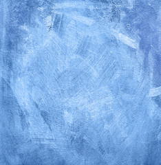 Empty retro blue stucco wall texture for background.