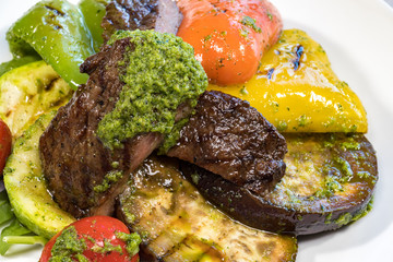Grilled vegetables on a white plate close-up