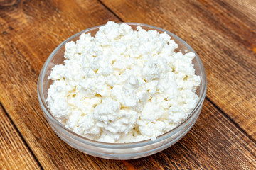 farm cottage cheese close up on wooden background protein healthy diet eco product