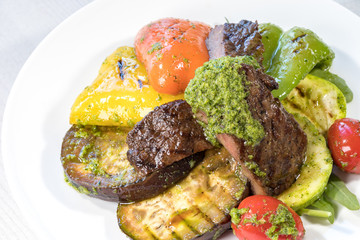 Grilled vegetables on a white plate close-up