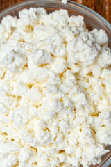 farm cottage cheese close up on wooden background protein healthy diet eco product