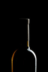 Wine bottle on a dark black background