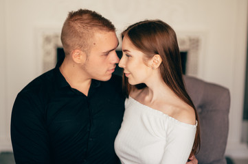 Portrait of happy young couple looking at each other and smiling. relationship between people