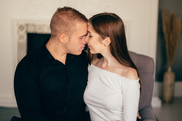 Portrait of happy young couple looking at each other and smiling. relationship between people