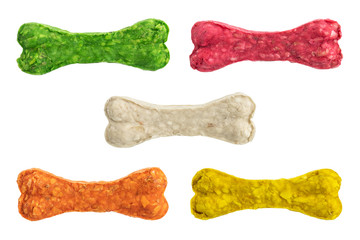 set of colorful rawhide bone for dog chew isolated on white background - obrazy, fototapety, plakaty