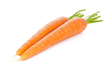 Isolated carrots. Heap of fresh carrots with stems isolated on white background